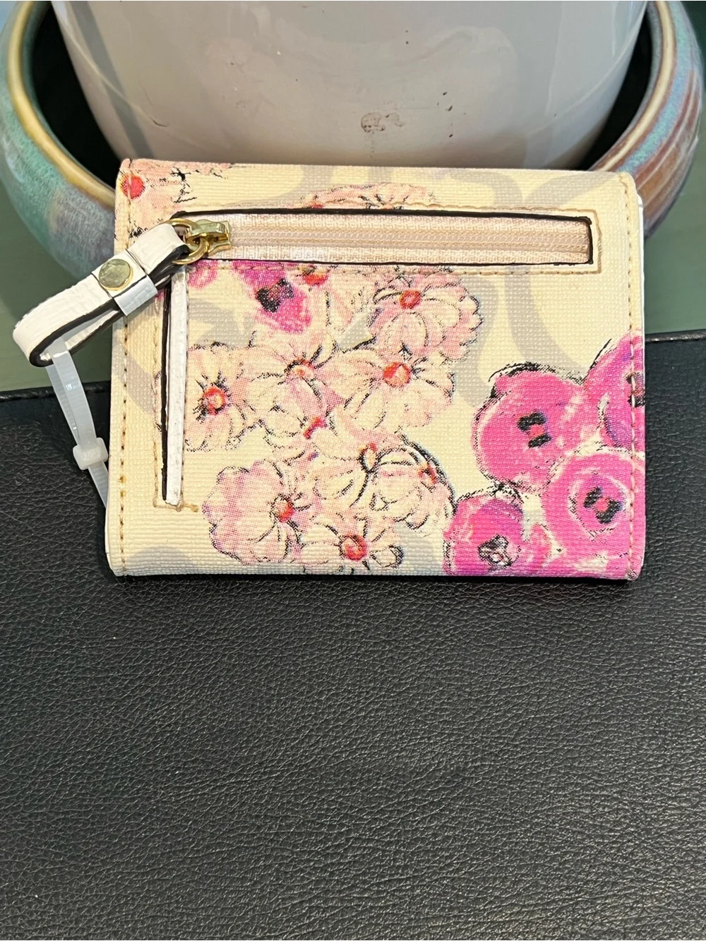 TOUS Cream Wallet with Pink Floral Accents and Gold Logo